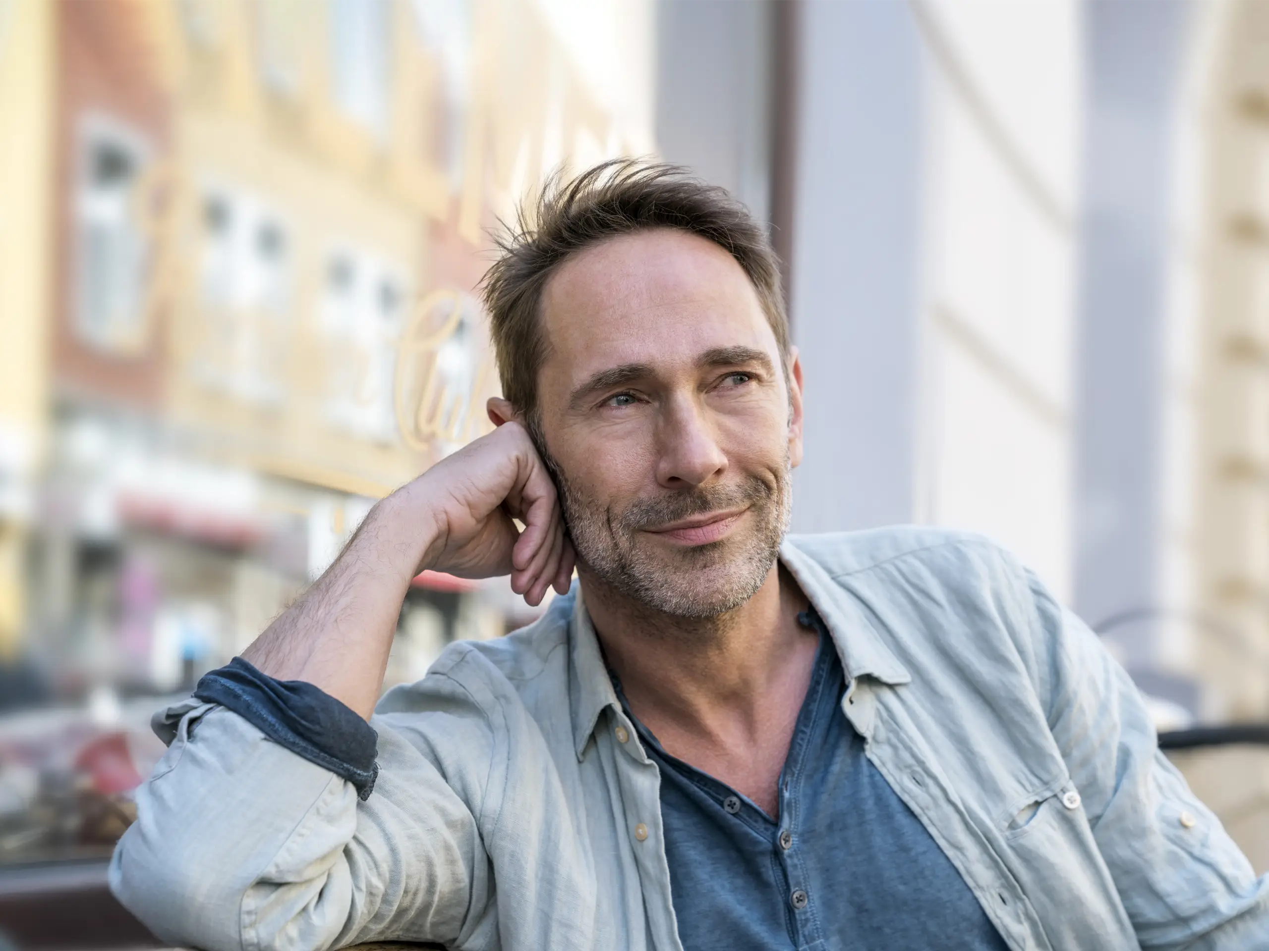 Portrait of a person in a relaxed professional outdoor setting